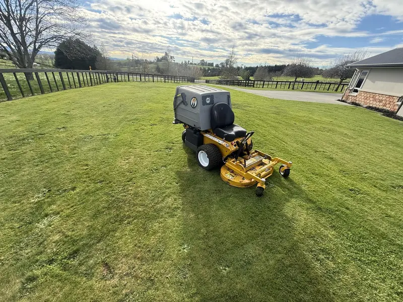 JR Lawn Mowing's ride-on mower at work on a Te Awamutu lawn